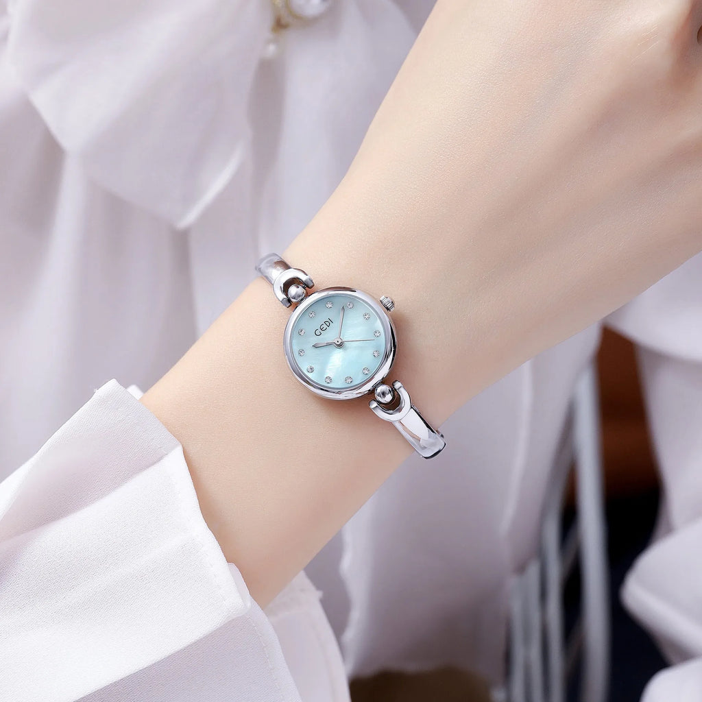 Silver case women's bangle watch with round dial and white plate silver stripe