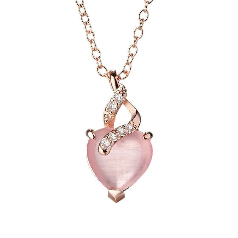 Women's heart-shaped artificial crystal pendant on rose gold electroplated cross chain necklace