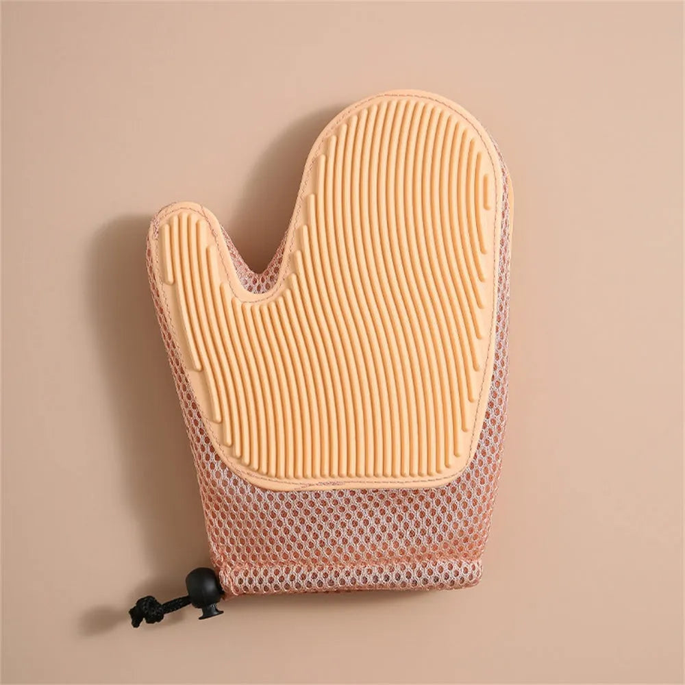 Dark blue pet hair removal glove with mesh surface for grooming dogs and cats and cleaning furniture.