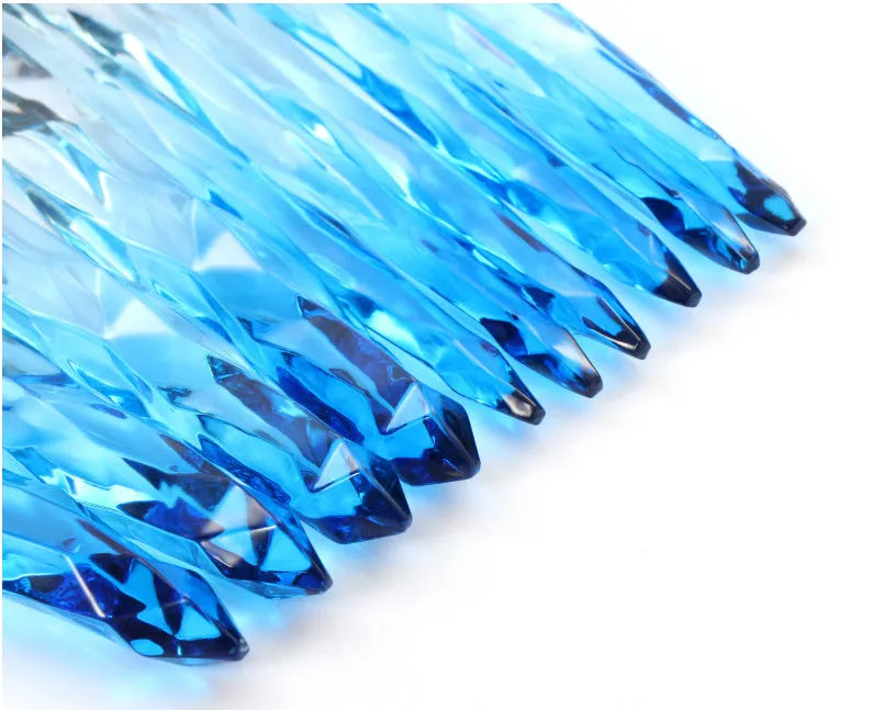 Ten crystal-handle foundation makeup brushes with synthetic bristles laid out flat