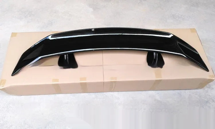 Universal punch-free car spoiler in ABS plastic with adhesive mounting