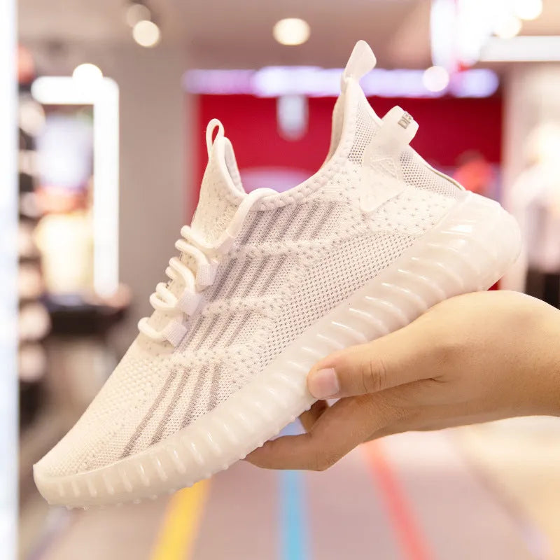 Men's white breathable fabric sports shoes with low-cut design and flat platform heel.