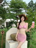Black or pink bear vacation themed three-piece bikini swimsuit set for swimming.
