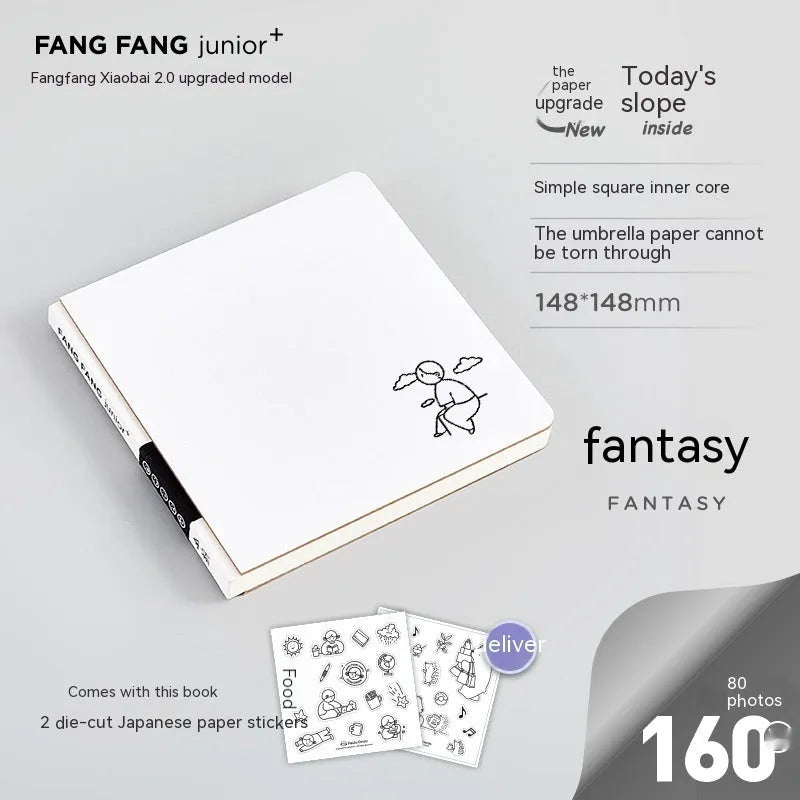Small white square notebook with checkered pages and decorative sticker sheets