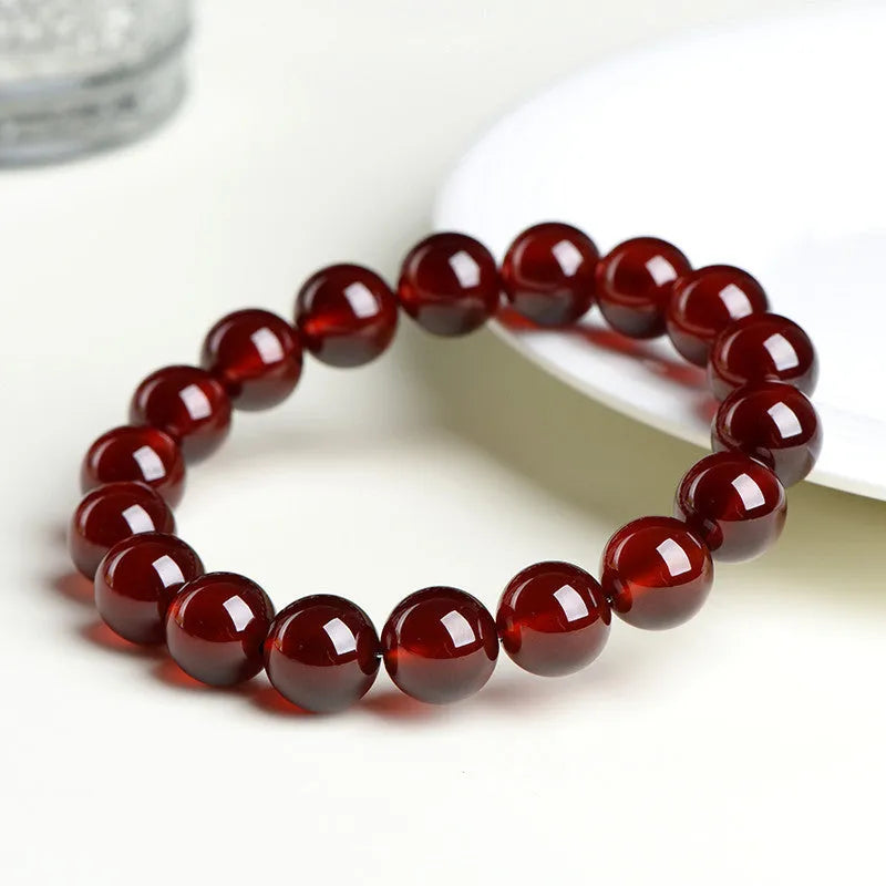 Natural orange red garnet crystal ball bracelet with retro Ruyi design and unisex styling
