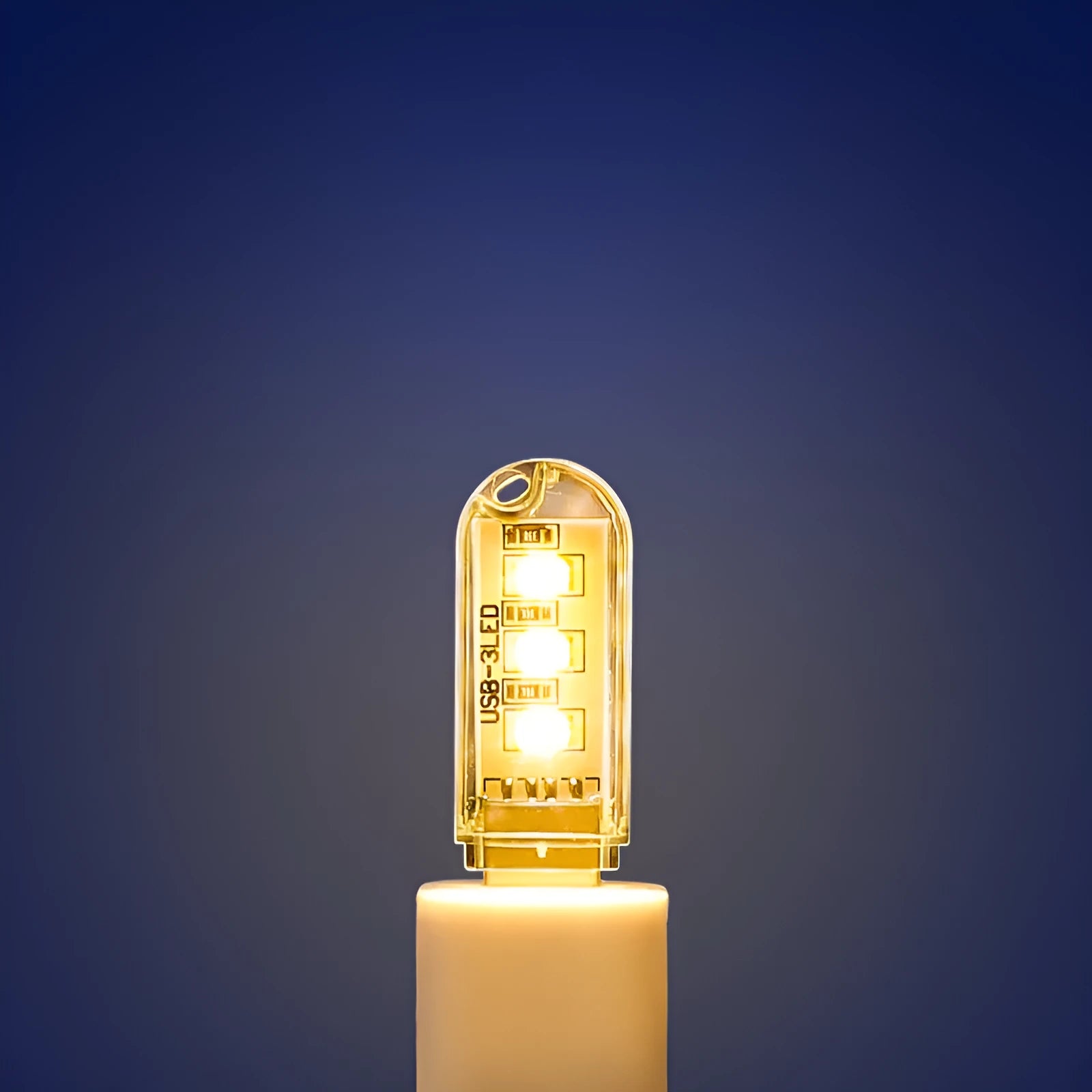 Small white USB-powered LED baby night light showing warm and cool light modes.