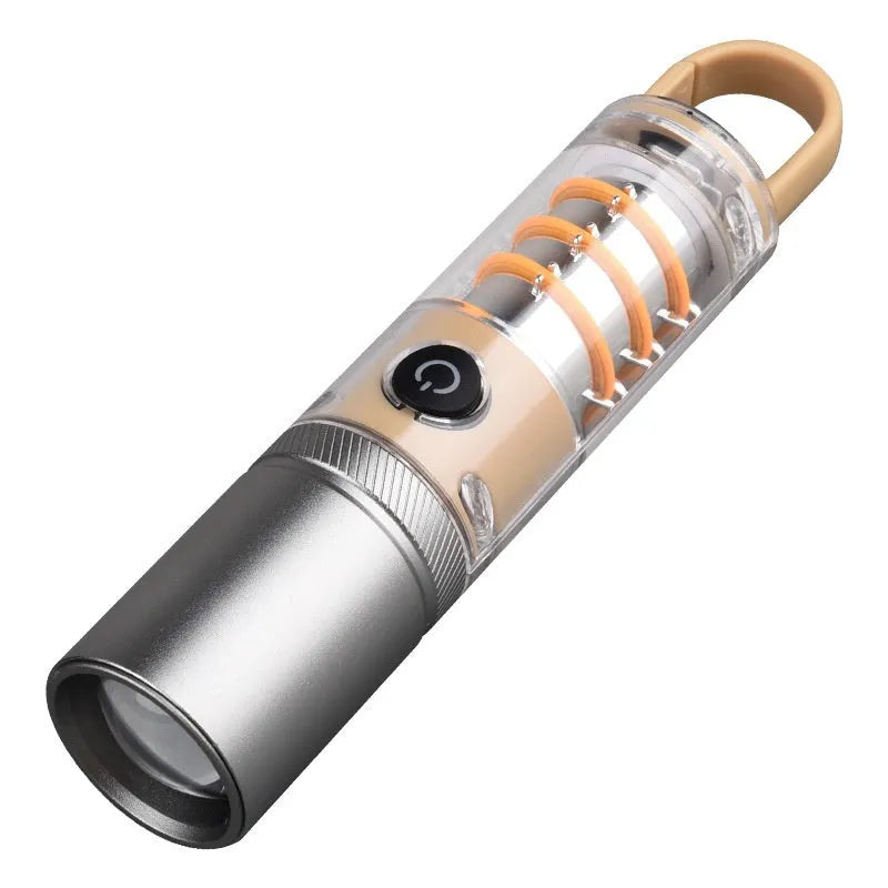 Orange and beige dual light source flashlight with hook and optical zoom ring