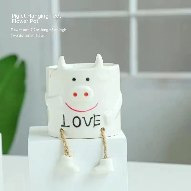 Ceramic hanging foot flowerpot for succulent plants on desktop