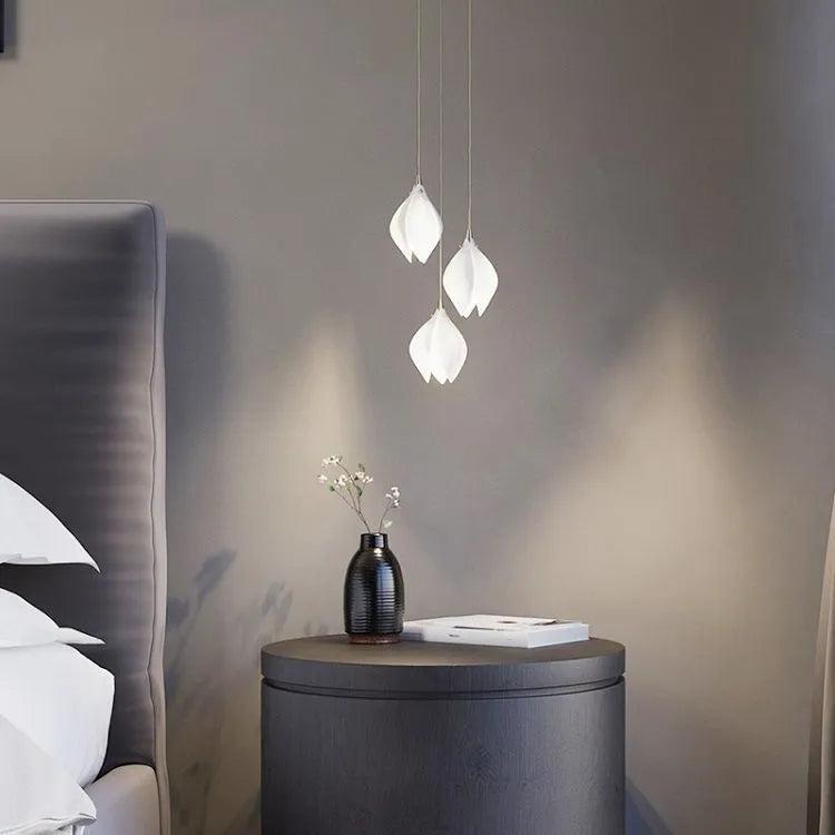 Ceramic magnolia coloured single-head pendant light with petal chandelier design.