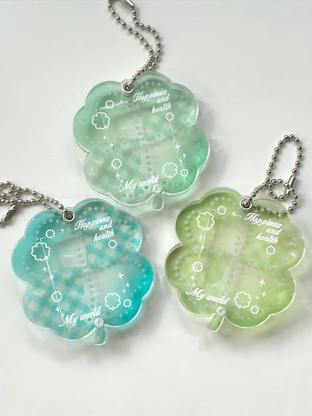 Acrylic four-leaf clover pendant keychain in elegant blue, grass green, or mint green.