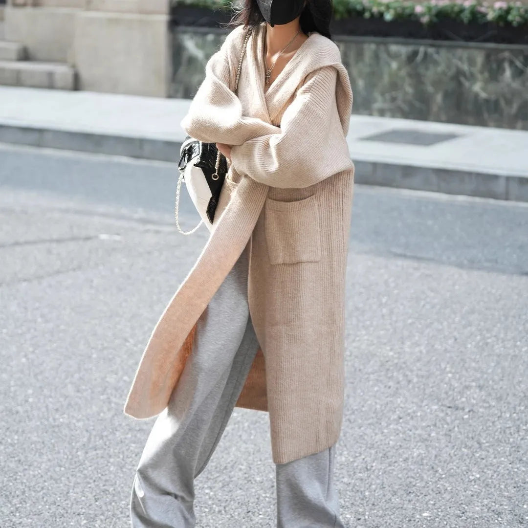 Long grey knitted cardigan with hooded trench coat design and regular long sleeves