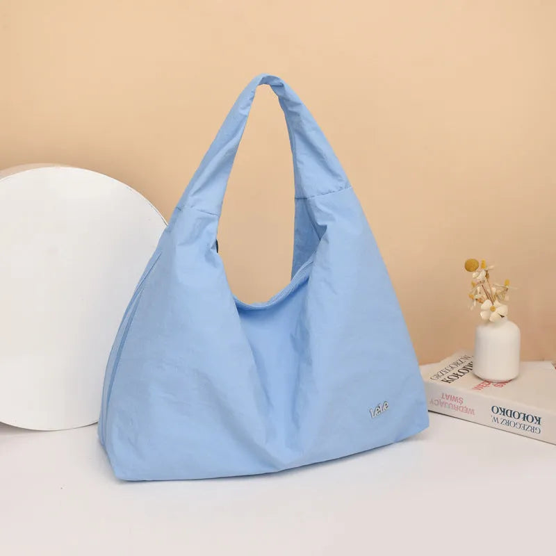 Women's heart-shaped nylon underarm bag in black, blue, khaki, and yellow colour options