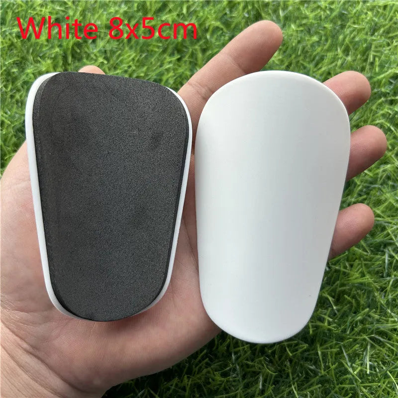 Extra small mini football shin guards plastic protection 8x5 cm black white youth