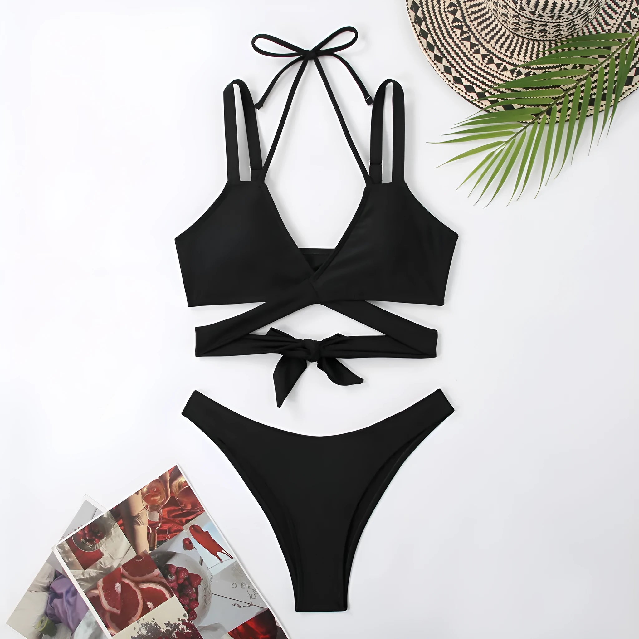 Women's solid colour strappy bikini swimsuit on a hanger, shown in briefs style.