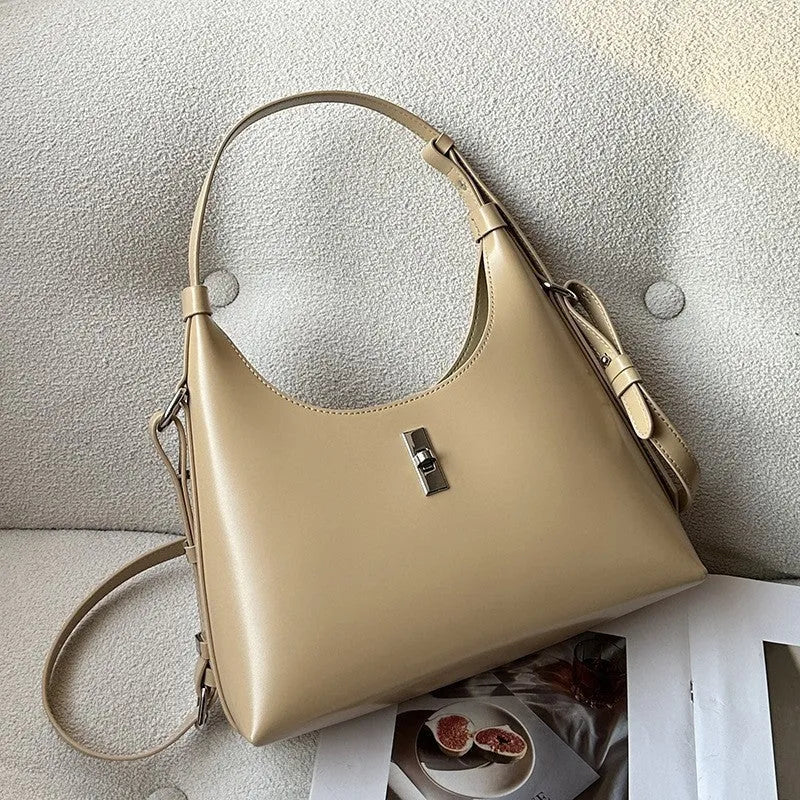 Genuine leather dumpling-shaped crossbody shoulder bag in apricot colour with a front sandwich pocket.