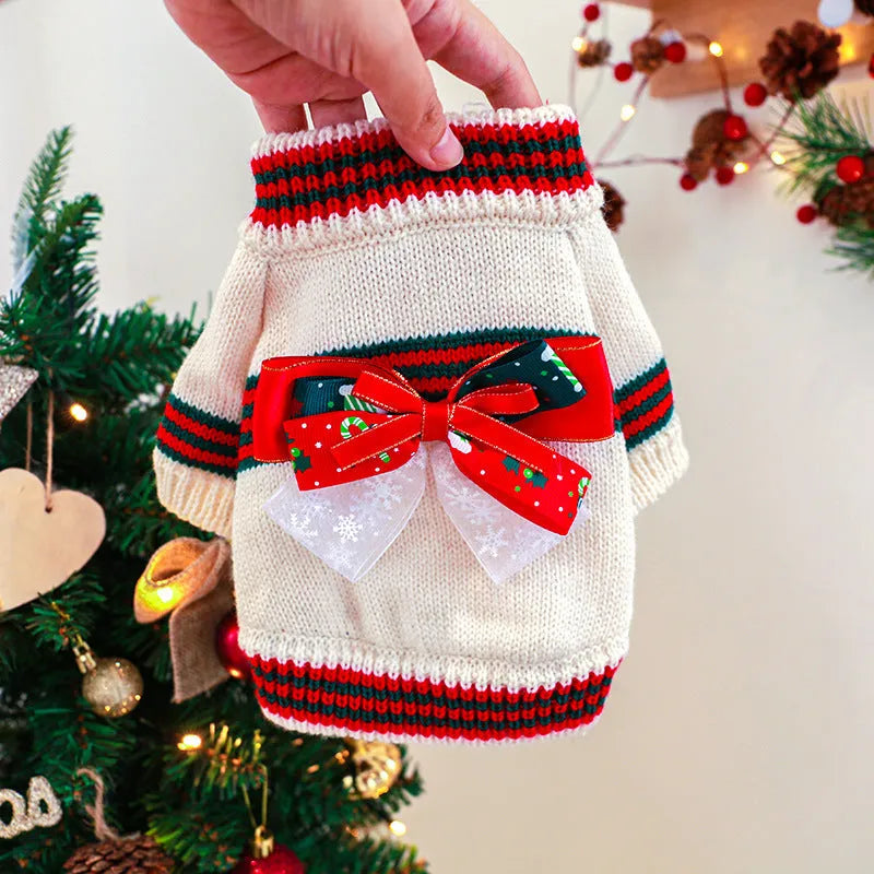A red polyester Christmas jumper for a dog, shown on a mannequin, with sizes ranging from XS to XL.