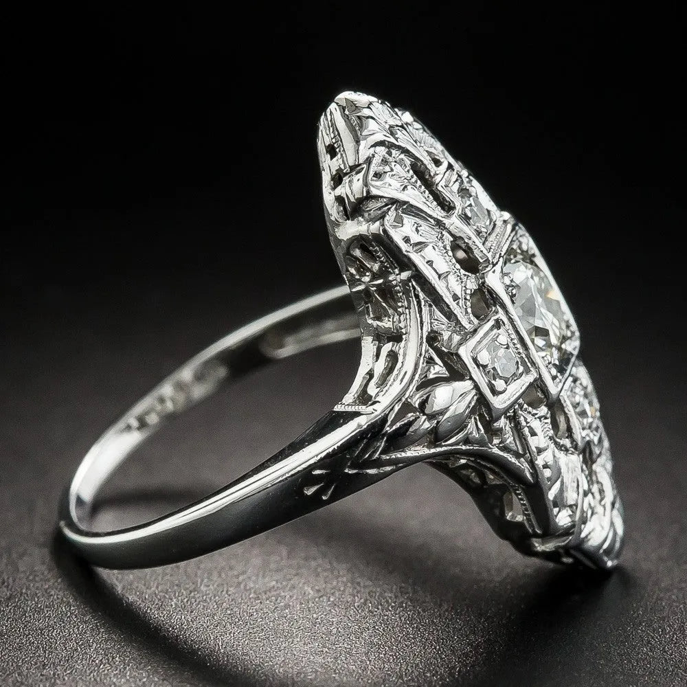 Silver hollow-out geometric ring with diamond-studded accents on copper base