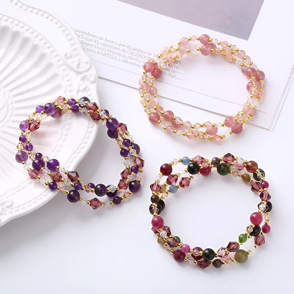 Close-up of a handmade three-stone crystal bracelet with an adjustable cord, shown in a choice of gemstone colours.