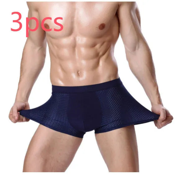 Men's solid colour ice silk modal boxer briefs showing U convex design on a mid waist.