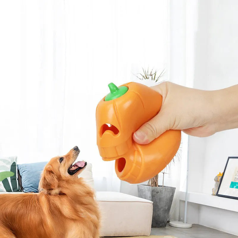 Orange Halloween pumpkin shaped interactive dog chew toy with a treat dispensing funnel.