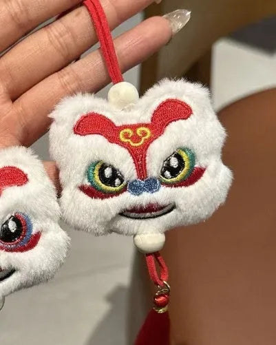 Chinese style plush lion keychain ornament with star stone details in blue or yellow colour