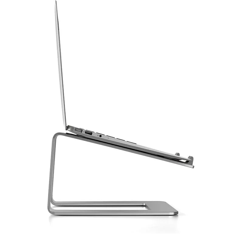 Black aluminium laptop stand on desk supporting silver laptop at improved viewing height