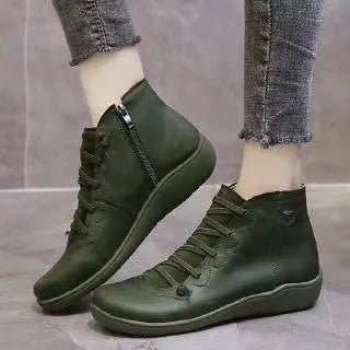 Women's black casual ankle booties with a flat wedge heel and round toe, made from PU with a rubber sole.