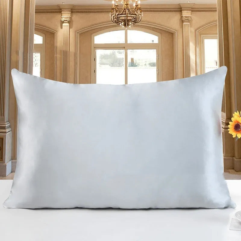 Double-sided silk pillowcase showing reversible design in apricot colour with three size options displayed
