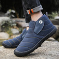 Men's thick cotton snow boots with a non-slip rubber sole in black, shown on a hard surface.
