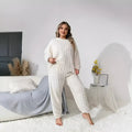 Women's creamy white polyester lounge set with crew neck top and matching trousers