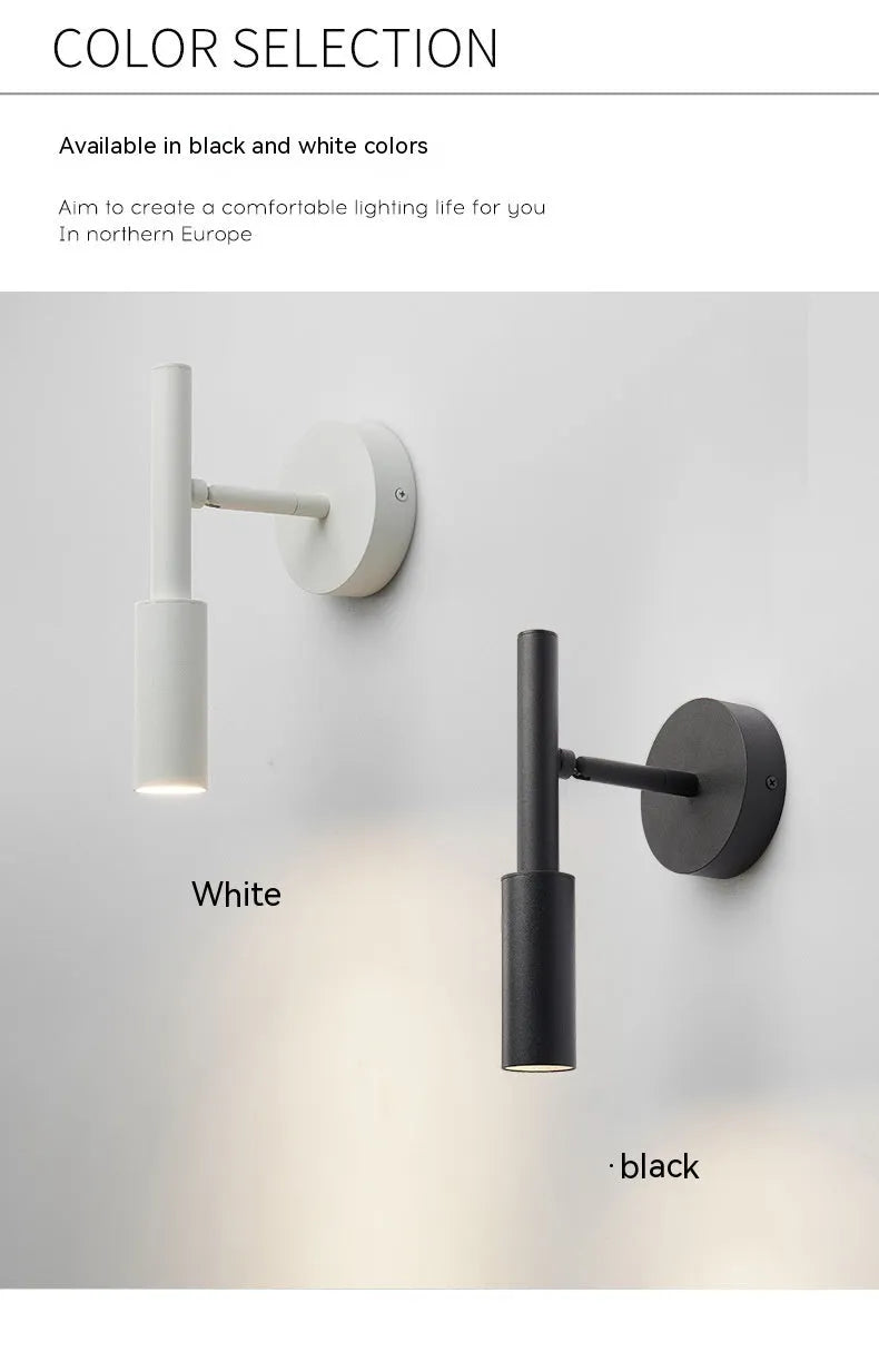 Modern wrought iron wall lamp in black or white, 100mm by 230mm, with three colour light options.