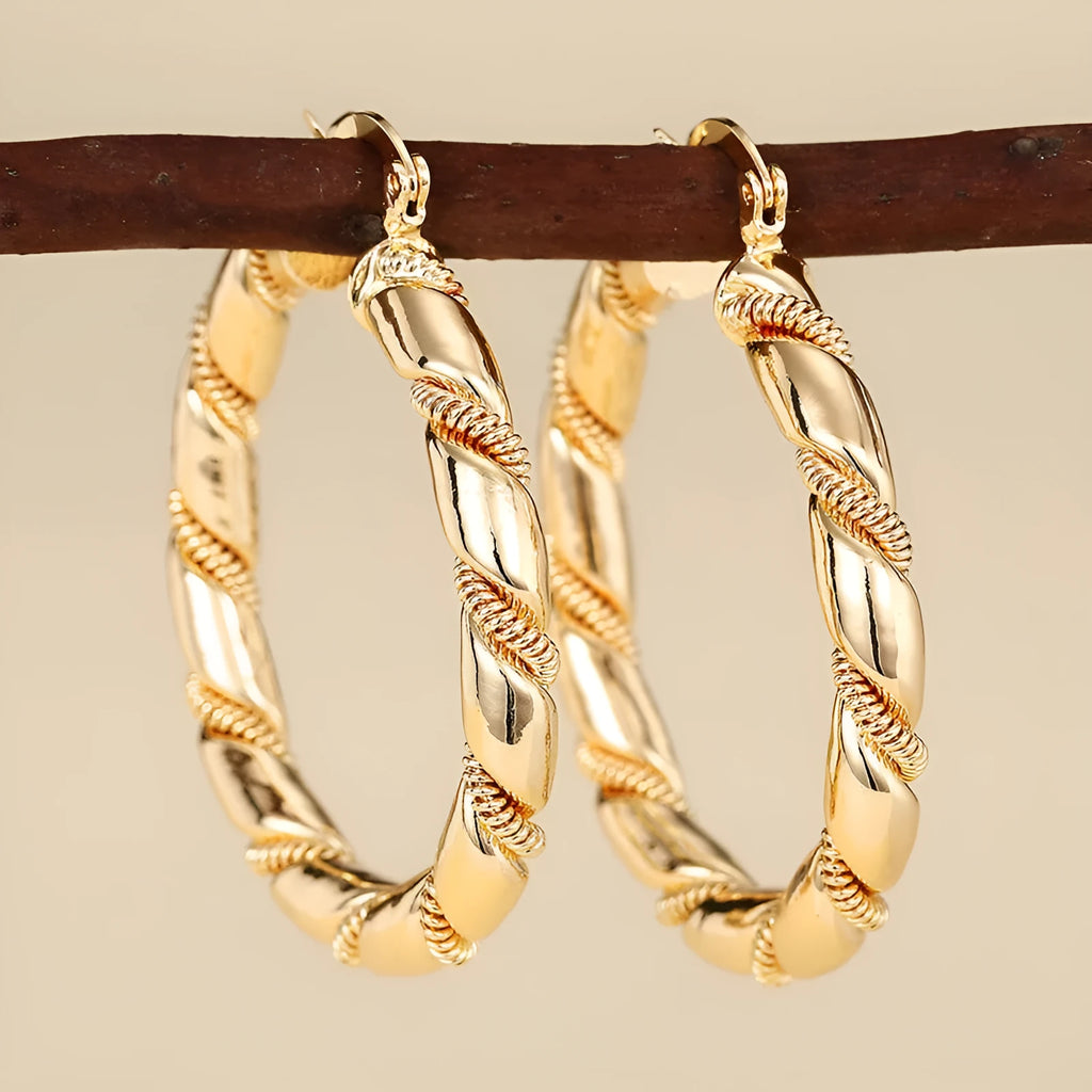Geometric women's earrings with ring and line design in golden copper