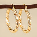 Geometric women's earrings with ring and line design in golden copper