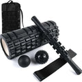 33cm long black foam roller massage stick with six raised gear pieces along its shaft.