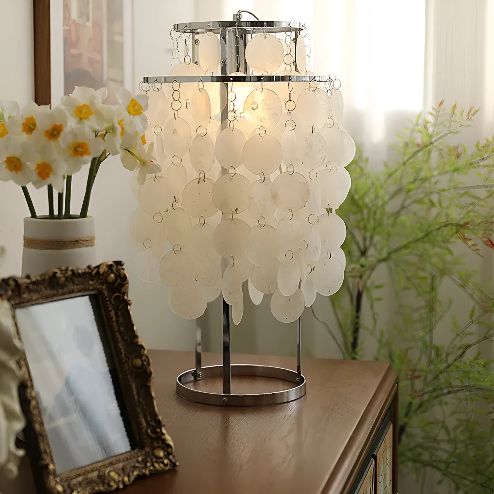 Modern shell design bedside table lamp in chrome or gold finish with slim profile