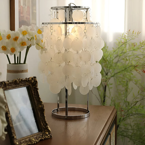 Modern shell design bedside table lamp in chrome or gold finish with slim profile