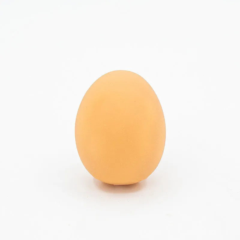 Green durable rubber dog chew ball toy with sound simulation egg inside for teeth cleaning.