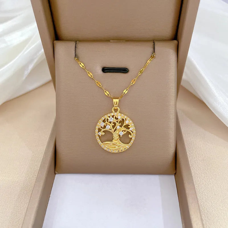 Gold-plated necklace with rhinestone lucky tree pendant and mother of pearl cross on adjustable chain