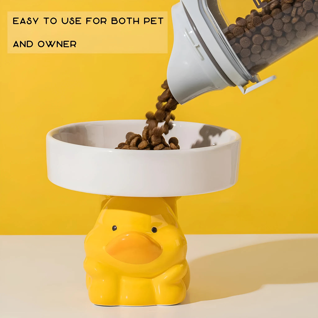 Raised ceramic cat food bowl in animal design, showing elevated height and wide bowl.