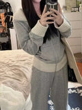 Light gray women's two-piece casual set with coat and wide leg trousers