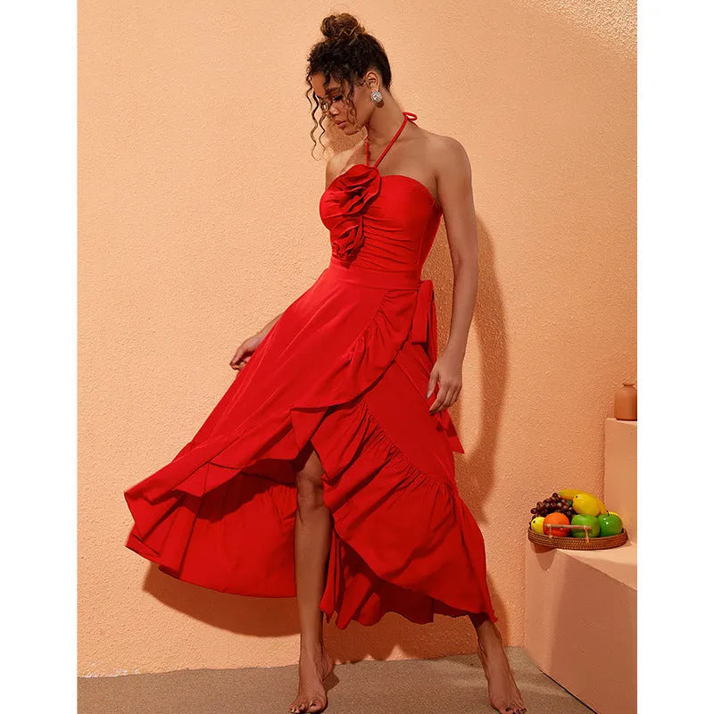Red floral print women's one-piece swimsuit with V-neck halter and detachable long skirt on a model.