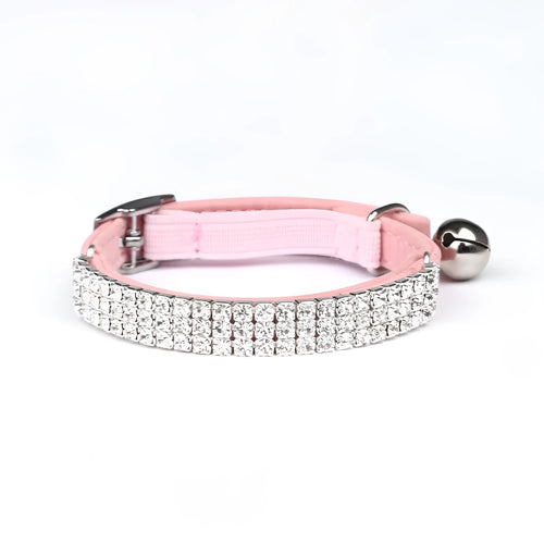 Adjustable velvet cat collar with rhinestones on a black background showing red, blue, and purple colour options.