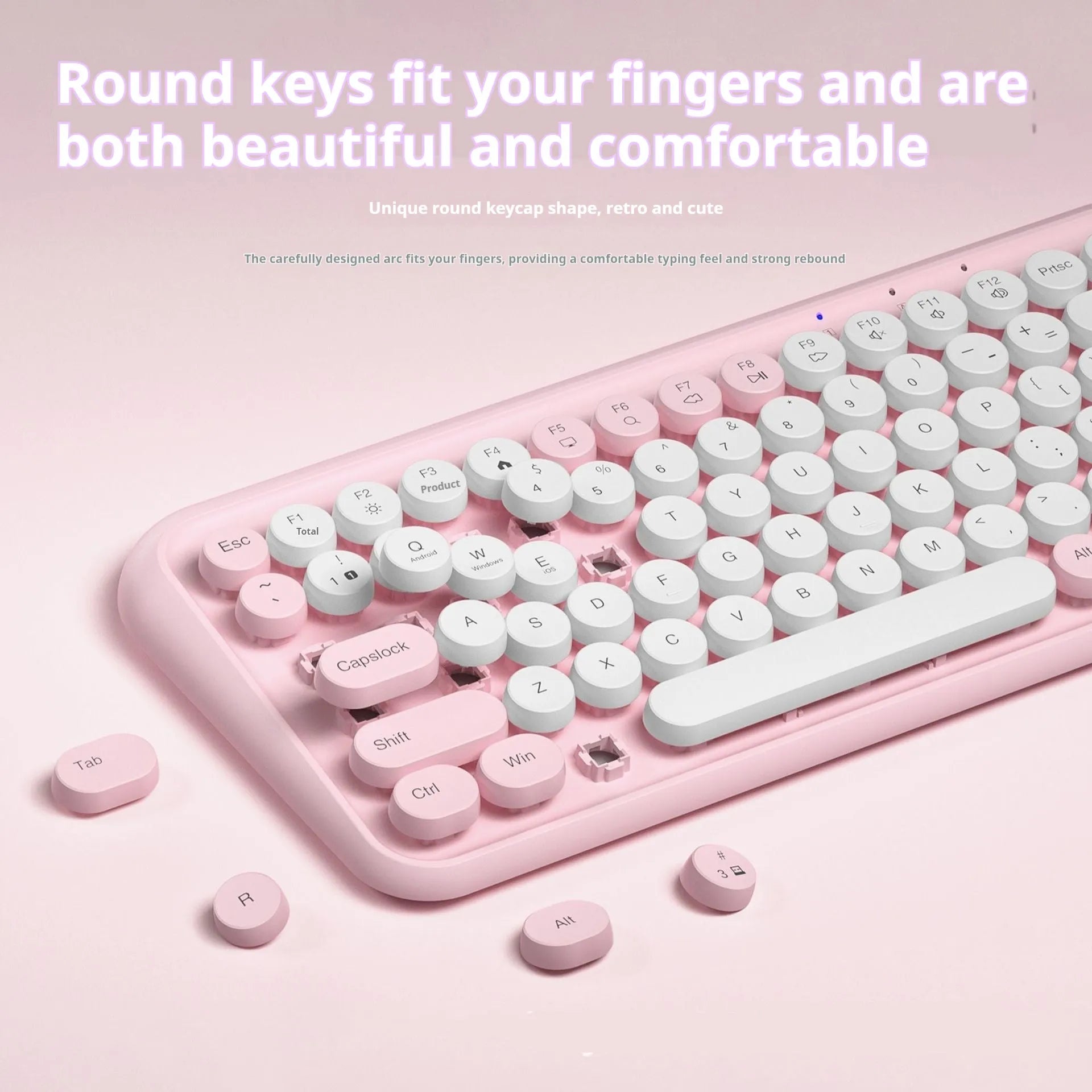 Pink dual-mode wireless Bluetooth mute portable keyboard with 84 keys and ABS construction on a desk