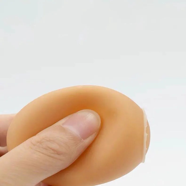 Green durable rubber dog chew ball toy with sound simulation egg inside for teeth cleaning.