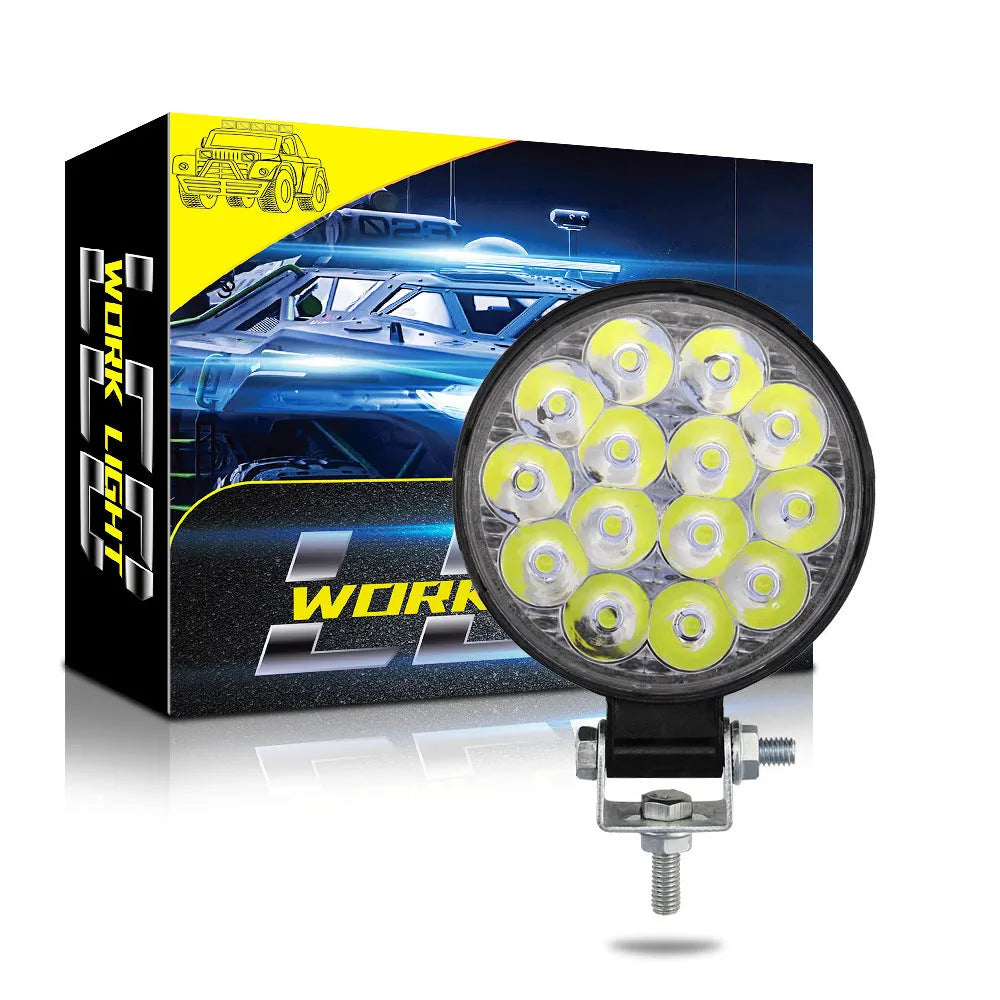 Mini round aluminium LED work light with white light, 42W power and IP67 waterproof rating.