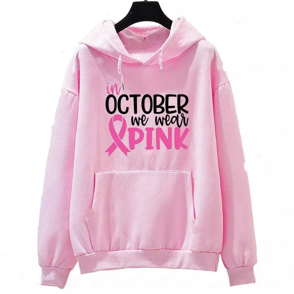Retro graphic 'I'm A Survivor' slogan pullover hoodie with side seam pockets in pink colour.