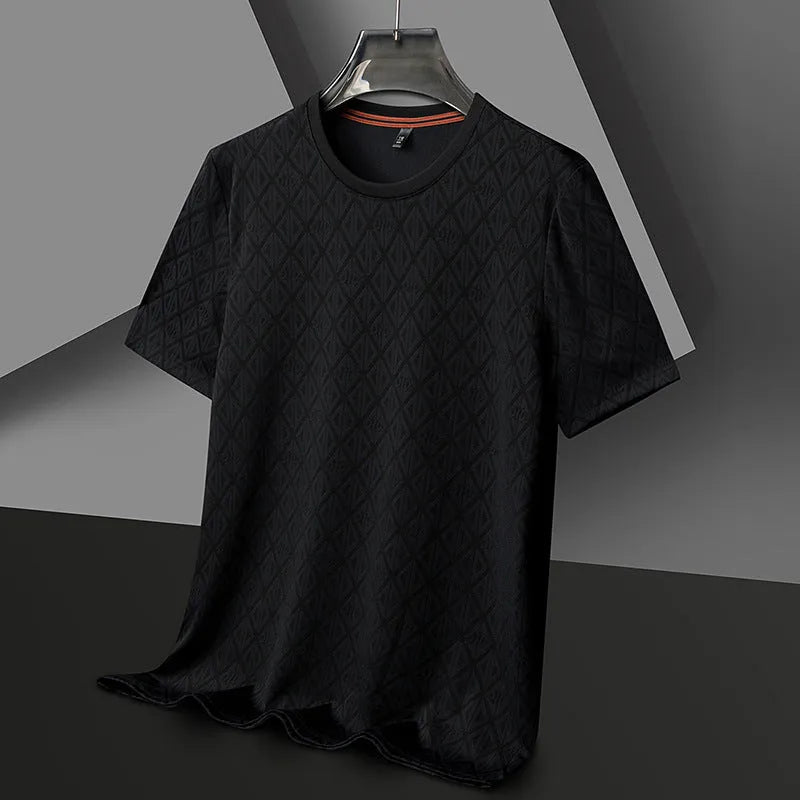 Man wearing a black loose-fit jacquard short sleeve t-shirt made from cool Ice Silk fabric.