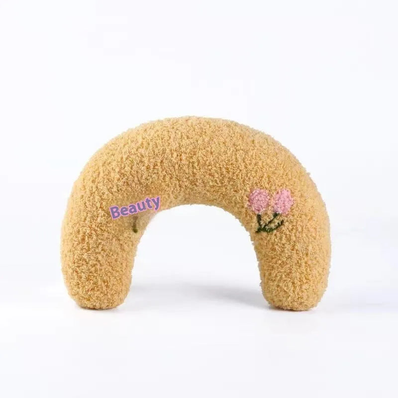 Blue U-shaped cat neck protection pillow with question mark design on white background