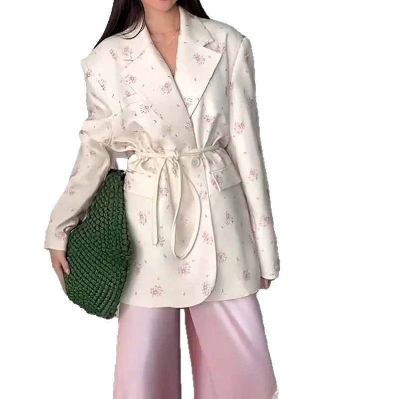 Women's white suit jacket with lace-up waist detail and regular long sleeves