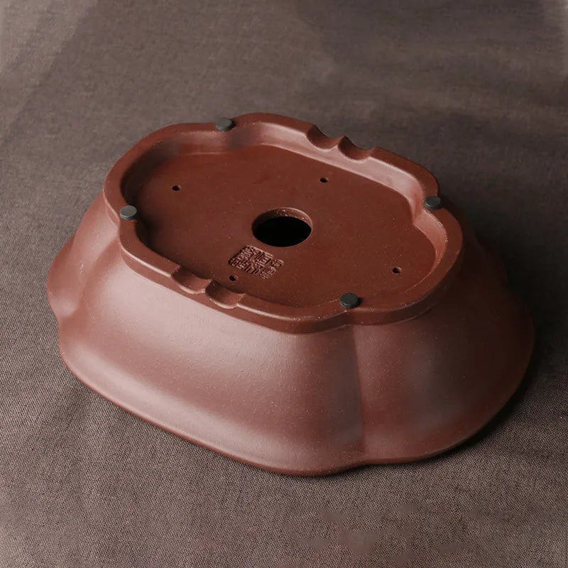 Handmade plain purple clay bonsai pot measuring 25 by 20 by 7 centimetres.